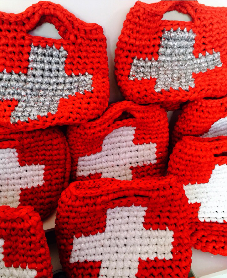 I Love Syria's CROCHET.me bag with Swiss flag, delicately made by displaced women in Syria.