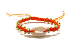 Natural shell bracelet with gold toupee on orange braided cord