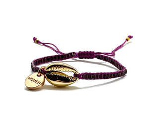 Gold shell bracelet, prune shiny seed beads and cord.