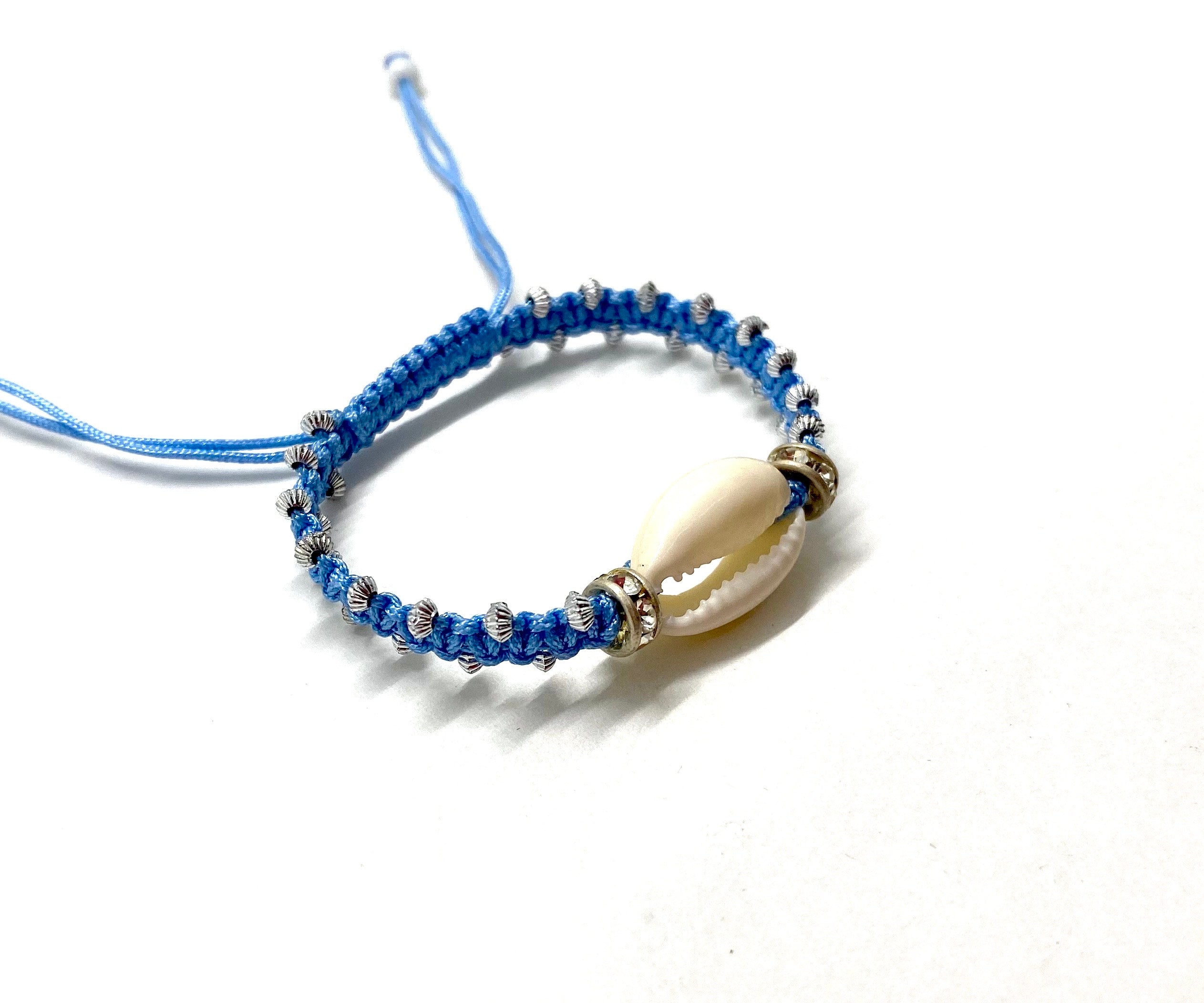 Natural shell bracelet, baby blue cord and gold toupee
