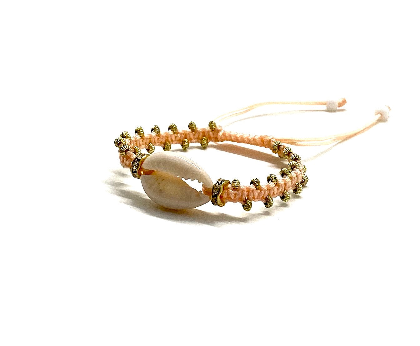 Natural shell bracelet pastel peach cord, gold toupee