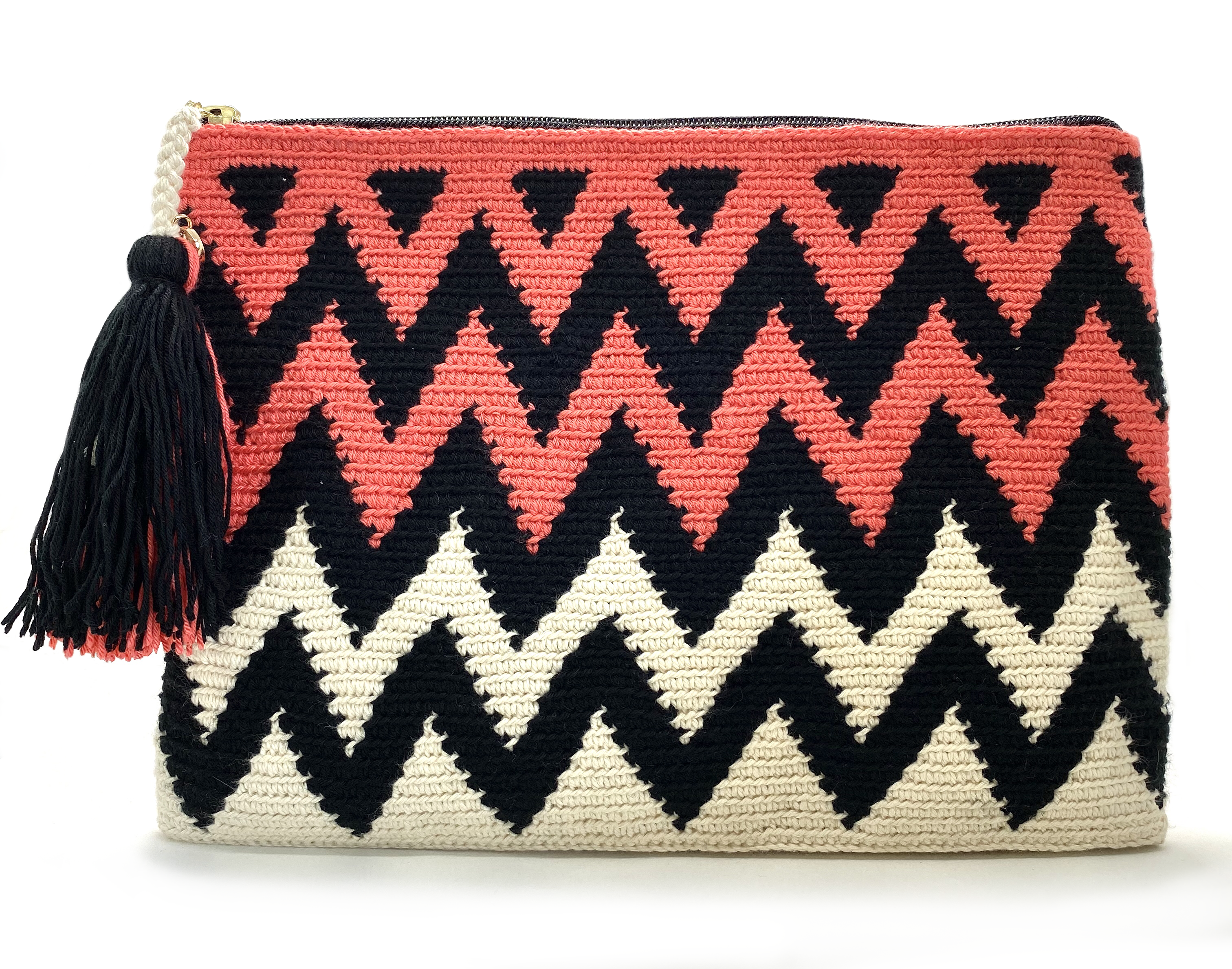 Clutch with half off white half coral body, black zigzag sequence and a tassel