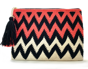 Clutch with half off white half coral body, black zigzag sequence and a tassel