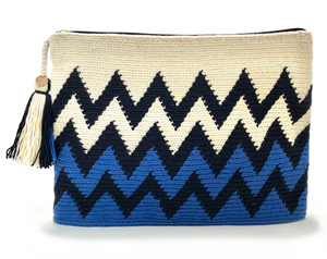 Black zigzag sequence, half cream and half electric blue clutch, with tassel.