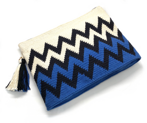 Black zigzag sequence, half cream and half electric blue clutch, with tassel.