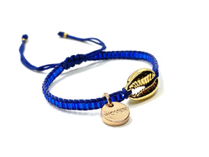 Gold Shell bracelet, with shiny blue seed beads and blue cord.