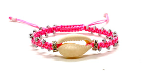 Cute natural shell bracelet with fluo pink cord an gold resin beads.