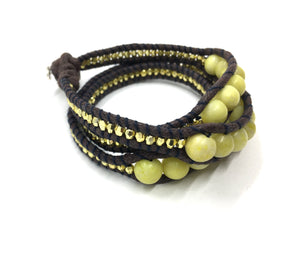 Wraparound Bracelet pale yellow stone, gold resin side beads, brown cord black thread.