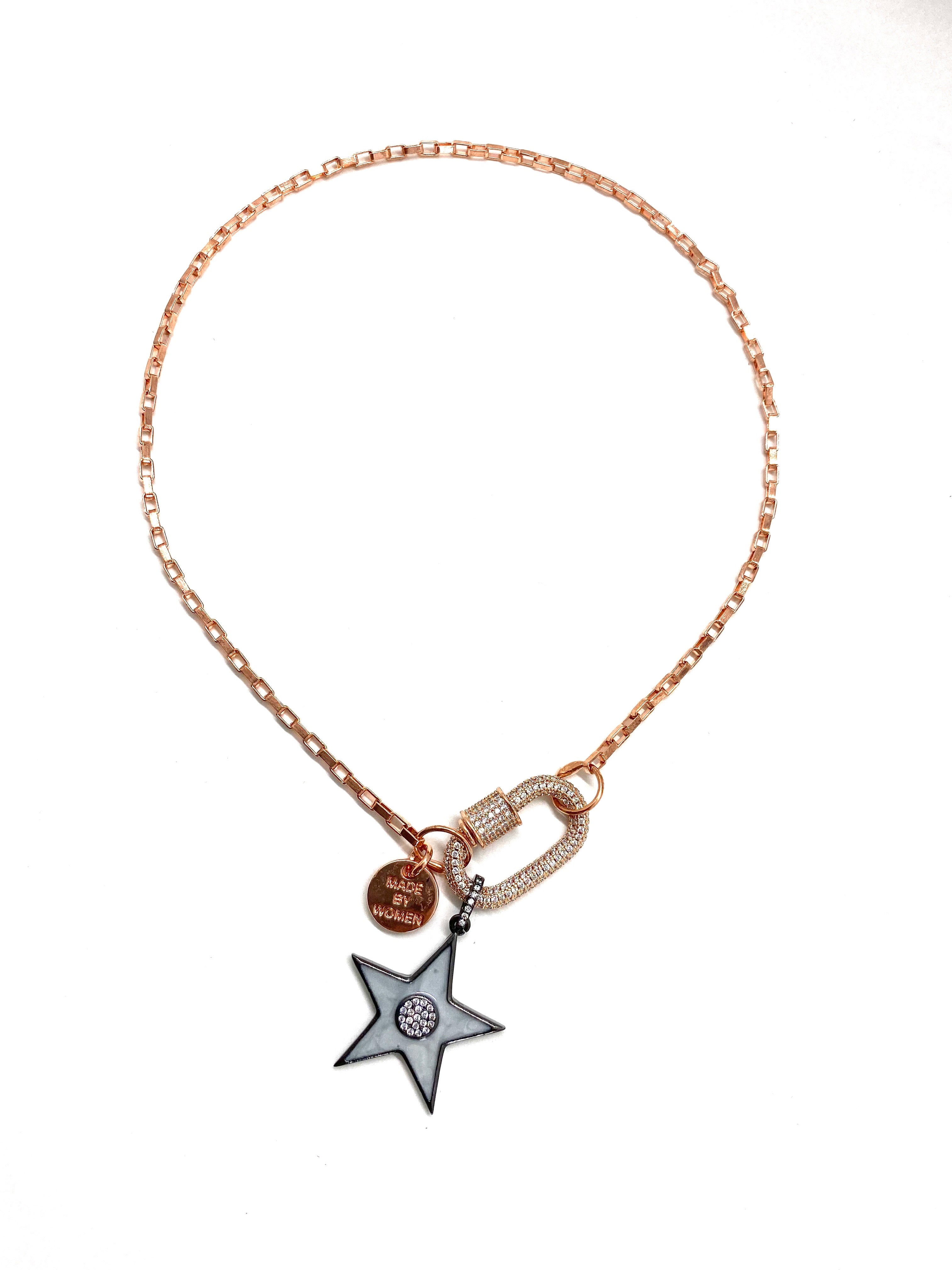 Clip to impact, rose gold chain with grey star.