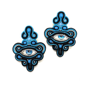 Evil eye earings with black and turquoise cord.