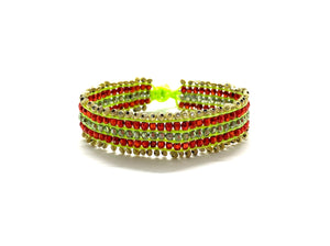 Beaded bracelet, gold and red beads fluo green cord.