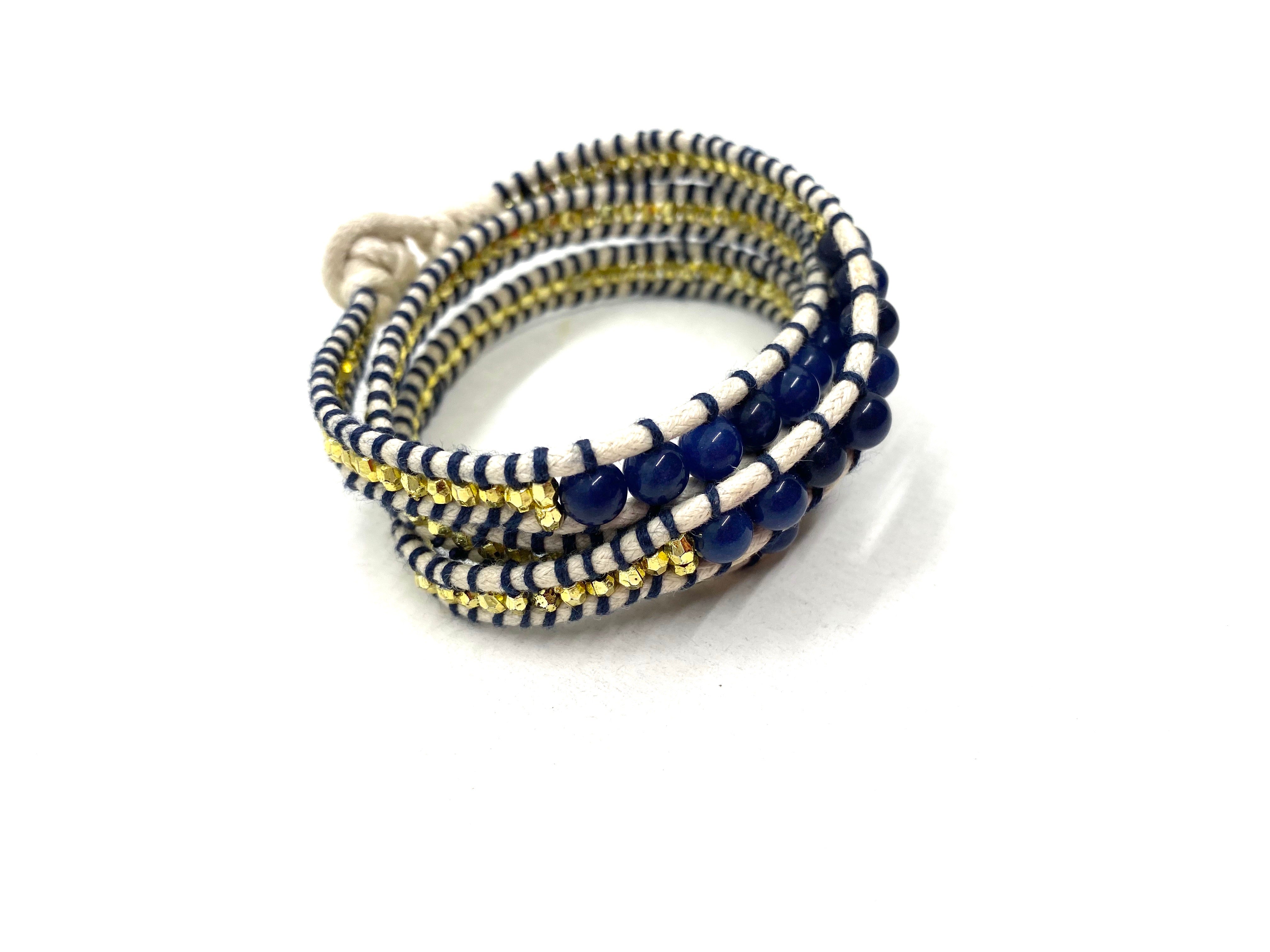 Wraparound dark blue beads bracelet, beige cord and gold resin side bead: