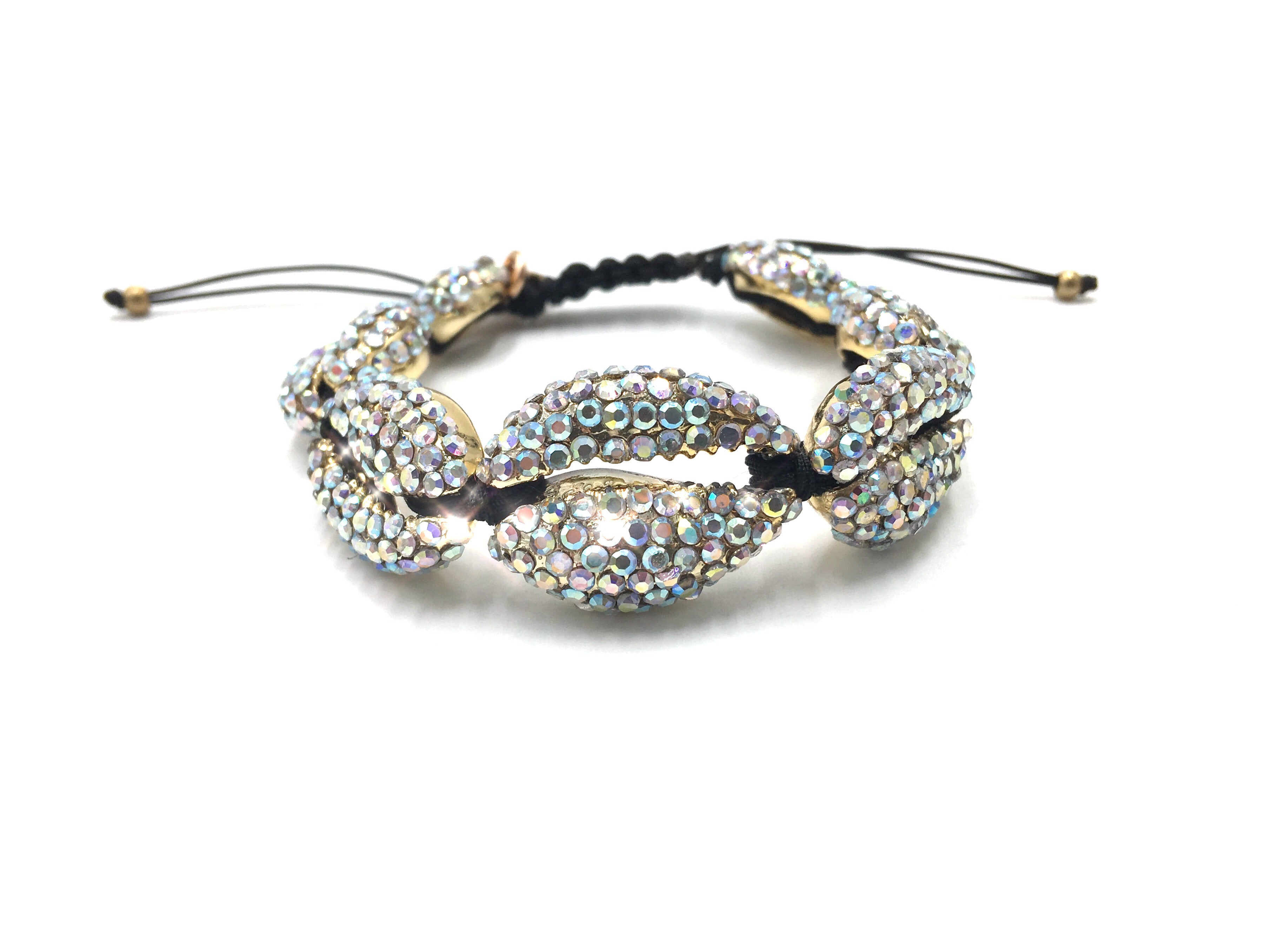 Gold shell bracelet crystallized in Swarovski, black cord.