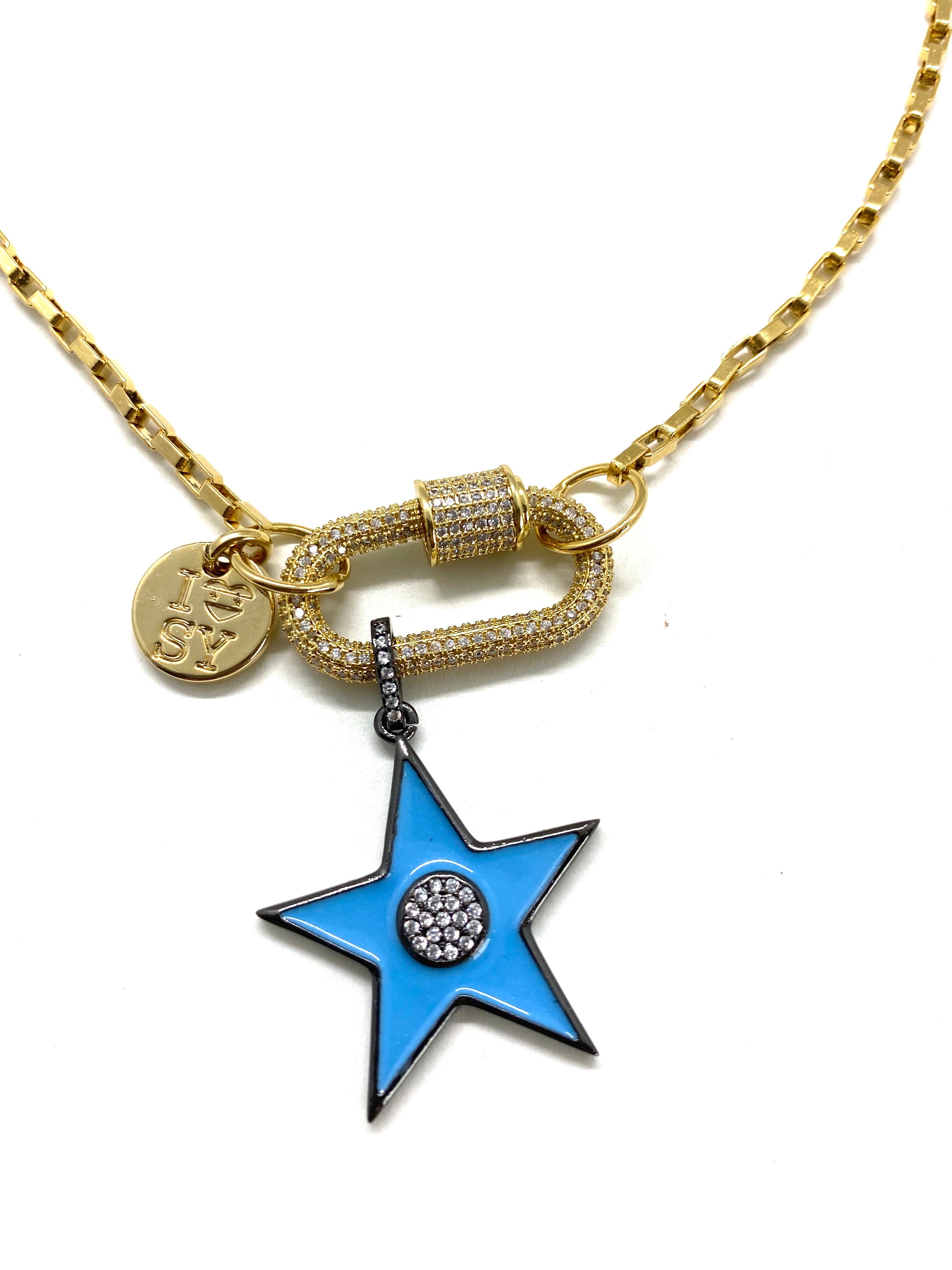 Clip to impact gold chain necklace, gold studded clip and blue star.