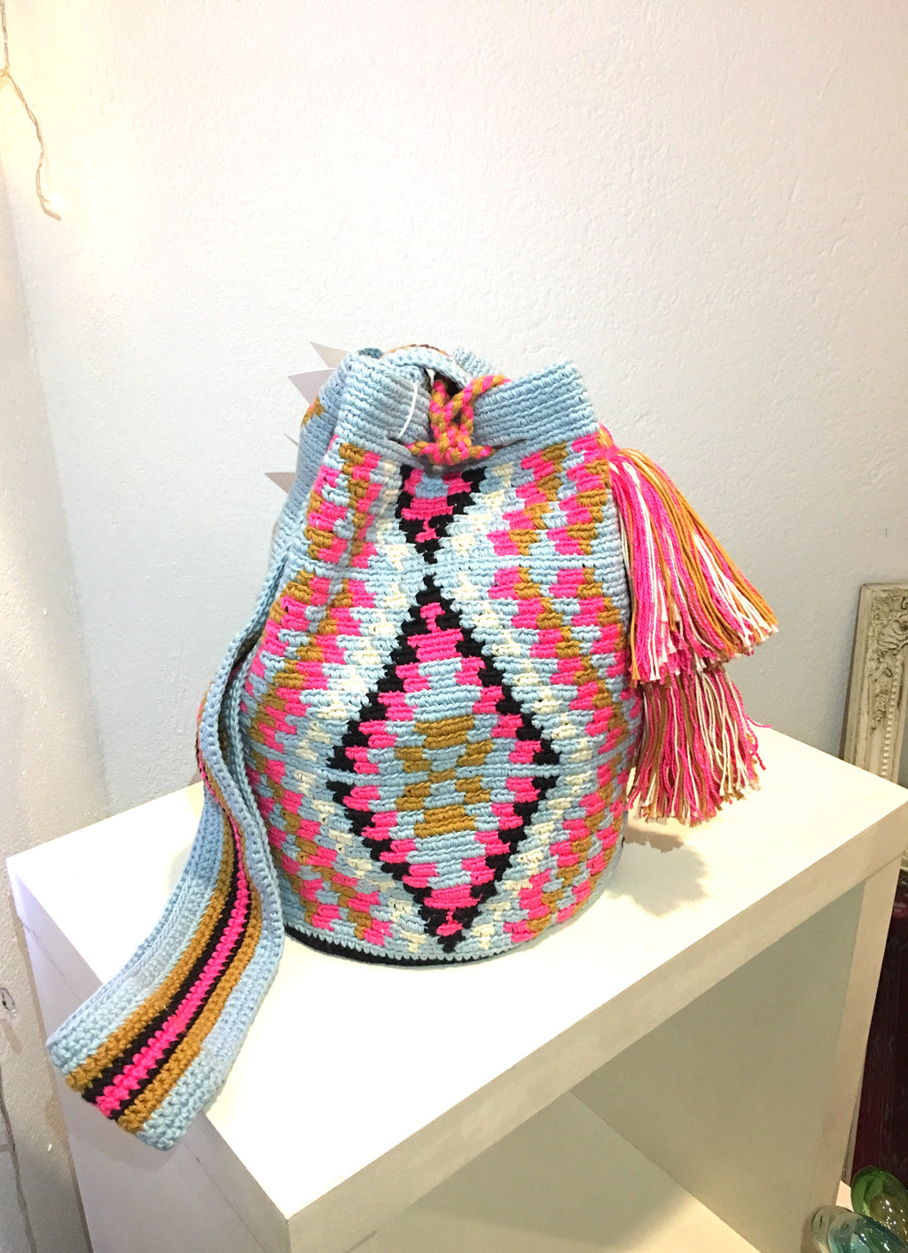 Pompom bag, fuchsia triangles, blue body.