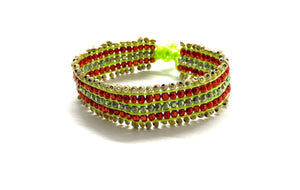 Beaded bracelet, gold and red beads fluo green cord.