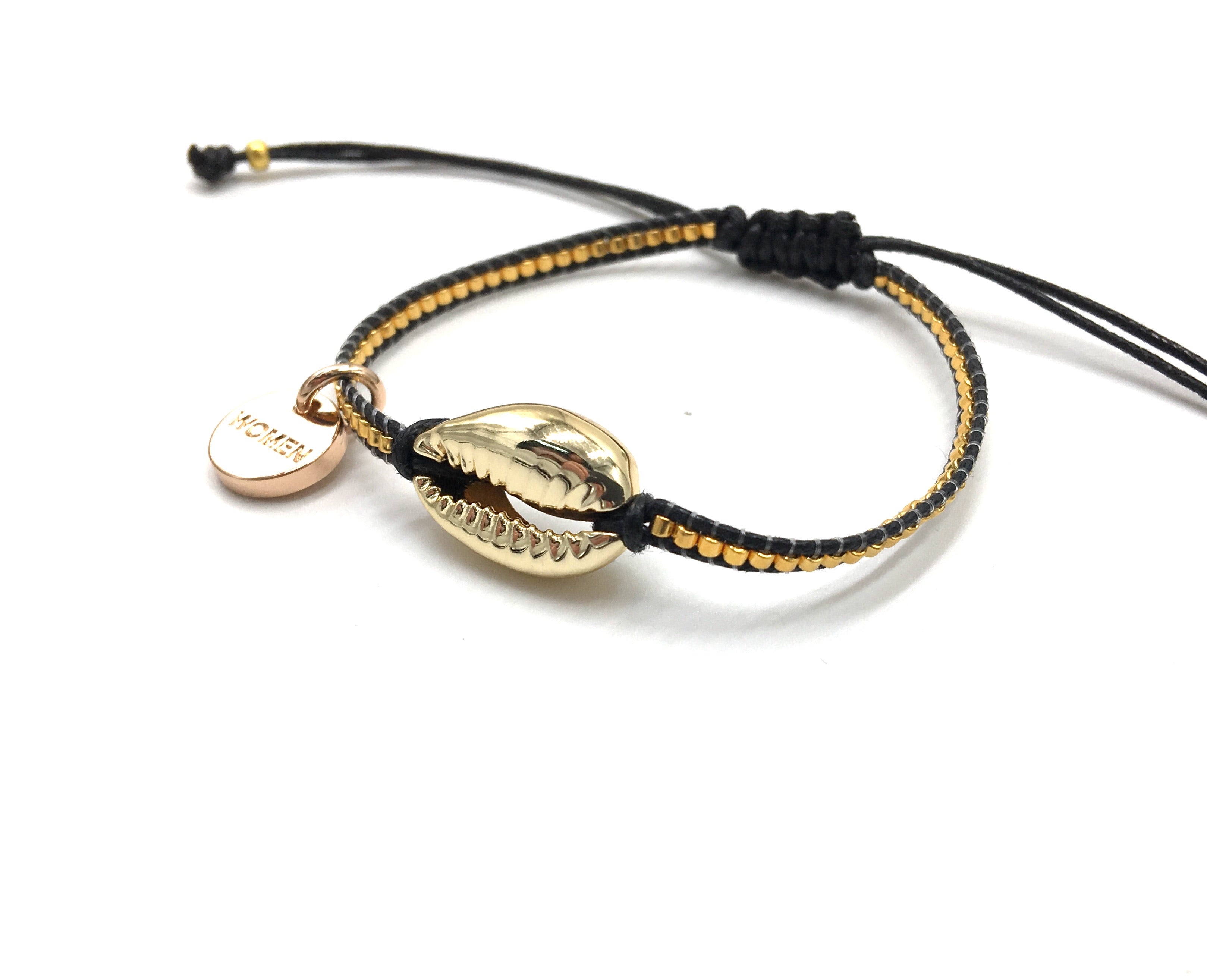Gold shell bracelet, with gold Miyuki beads, and black cord.