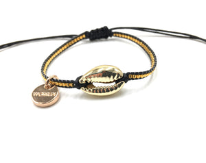 Gold shell bracelet, with gold Miyuki beads, and black cord.