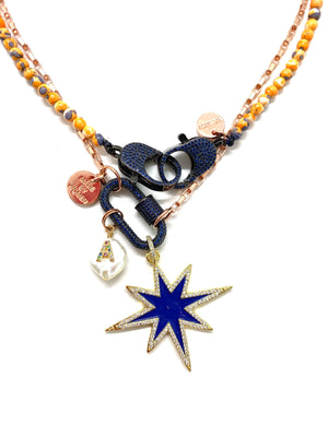 Rose gold chain, dark blue studded clip and blue star