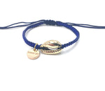 Gold Shell bracelet, mat blue seed beads and dark blue cord.