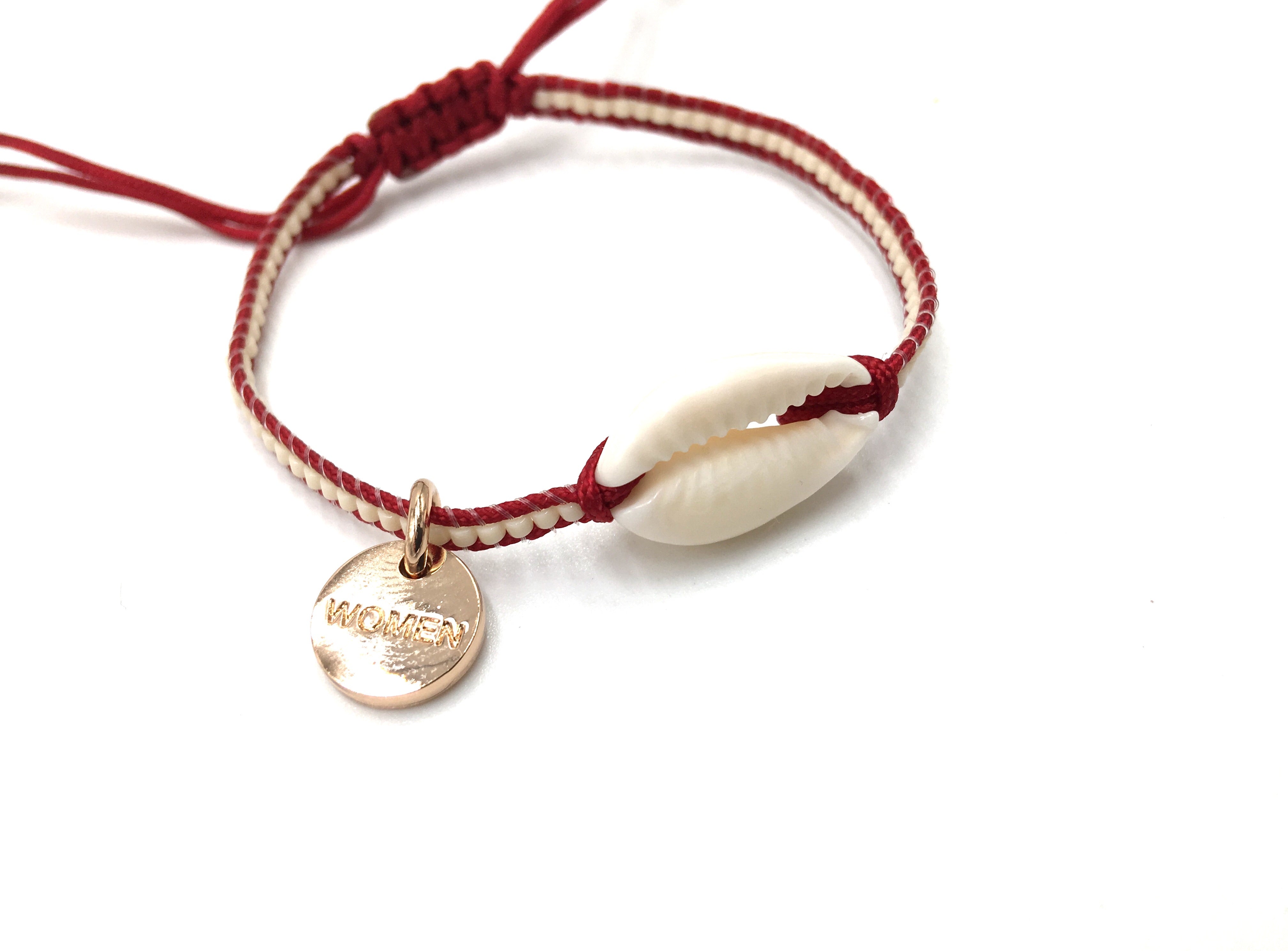 Natural shell bracelet, cream mIyuki and dark red cord.