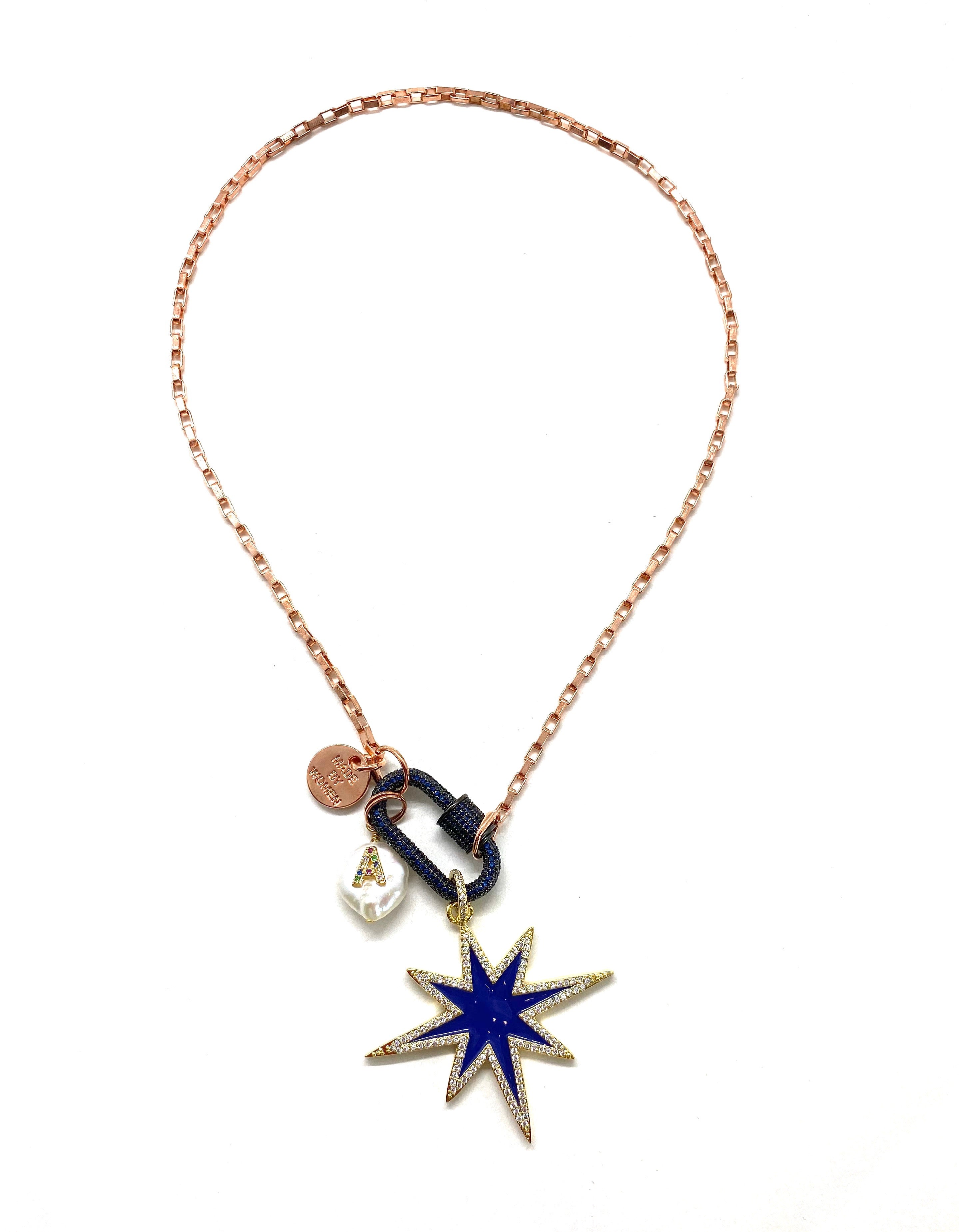 Rose gold chain, dark blue studded clip and blue star