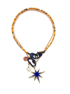 Rose gold chain, dark blue studded clip and blue star