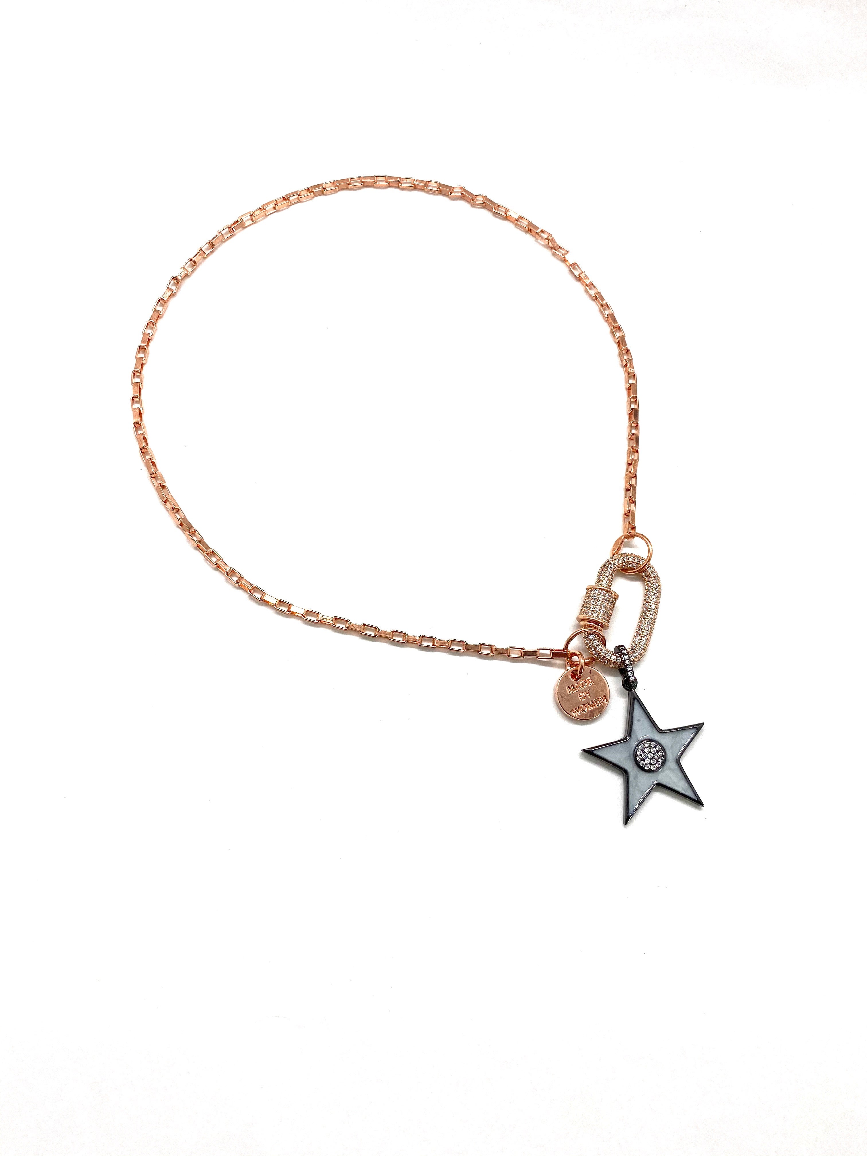 Clip to impact, rose gold chain with grey star.